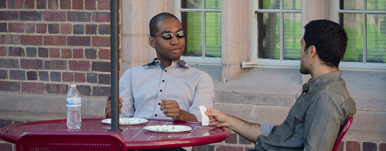 faculty member and student having lunch and a conversation