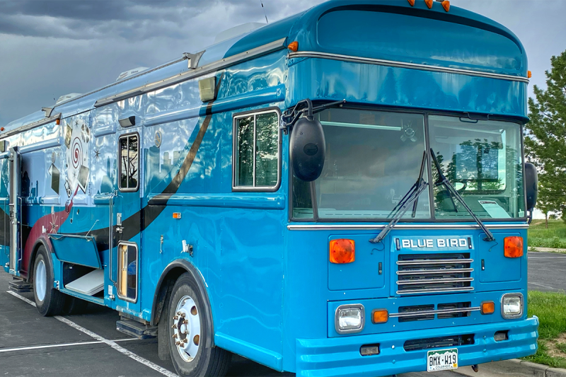 blue school bus turned into a classroom