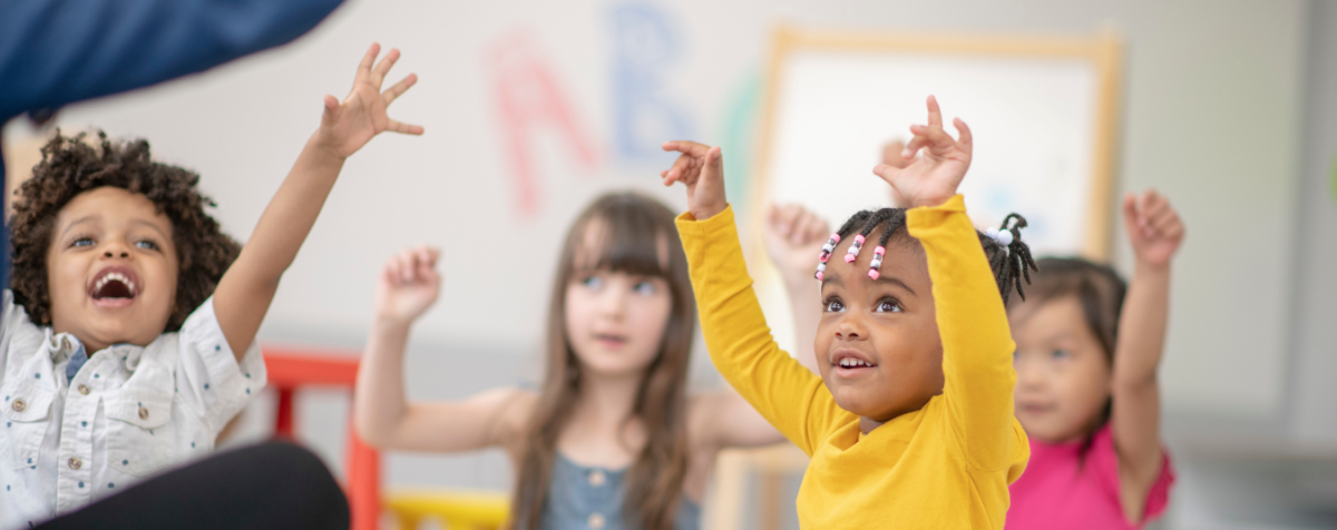 Group of children play movement game.