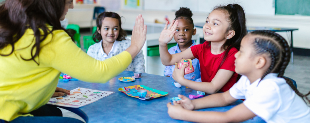 Teacher high-fives student