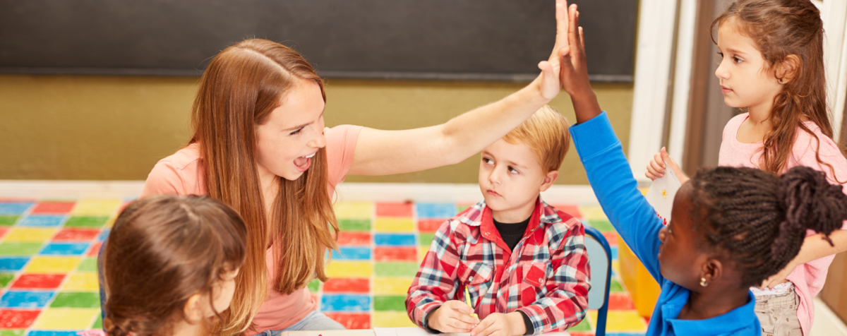 Teacher high-fives student