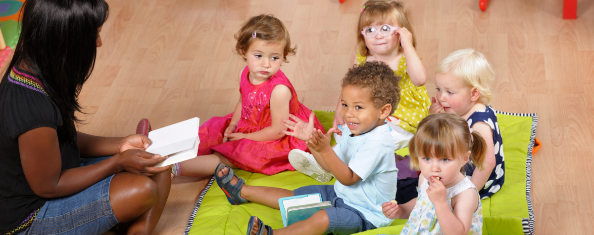 A teacher reads to young children