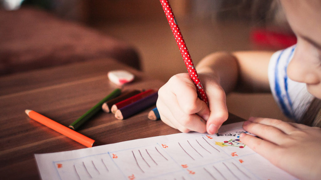 little girl writing